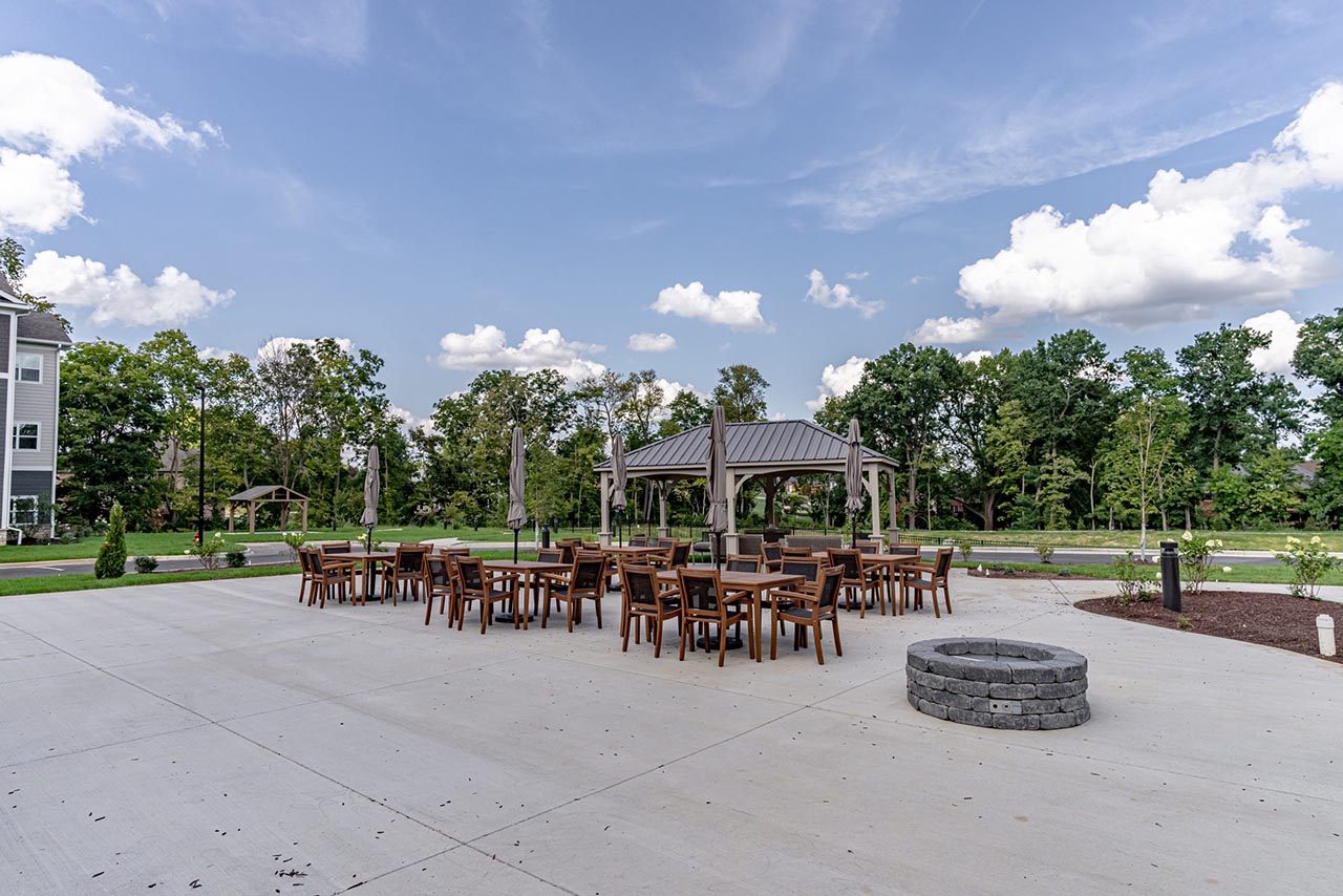 outdoor patio with tables, gazebo and fire pit